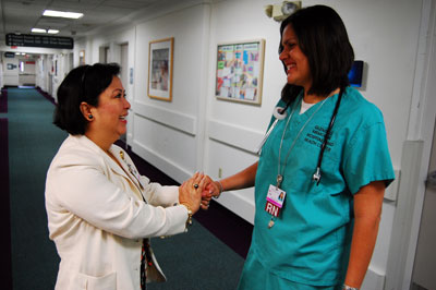 Delia stops to talk to her supervisor about attending another training for three months in Las Vegas.  Her supervisor doesn't want to let  one of her best nurses go for too long.