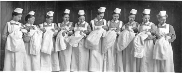 The first time there 10 babies in the nursery November 1915 left to right: Clara Schmidt, Lydia Goertz, Anna Gertrude Penner, Elfriede Sprunger, Dora Richert, Anuta Dirks, Marie Lohrentz, Ruth Becker, Elise Fast, Rosa Jantzen used in Lana W. Myers, Newton Medical Center: Merging the Past with the Future (2006), p. 58-59